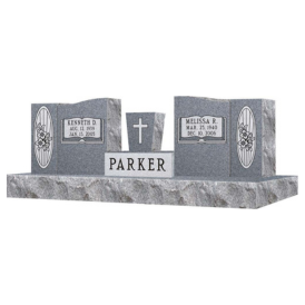 Double headstone with middle vase and last name Parker in middle